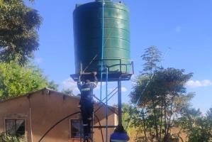 The huge water tank being installed near the well to make the water project work.